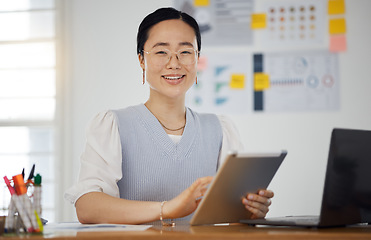 Image showing Portrait of Asian woman at desk with smile, tablet and research for business website, online report or social media. Internet, digital app and businesswoman in office with web schedule and confidence