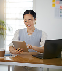 Image showing Asian woman at desk with smile, tablet and scroll for research on business website, online report or social media. Internet, digital app and businesswoman in office on web schedule and reading email.