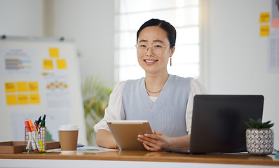 Image showing Portrait of Asian woman in office with smile, tablet and research for business website, online report or social media. Internet, digital app and businesswoman at desk with web schedule and confidence