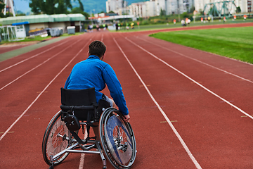 Image showing A person with disability in a wheelchair training tirelessly on the track in preparation for the Paralympic Games