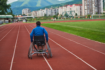 Image showing A person with disability in a wheelchair training tirelessly on the track in preparation for the Paralympic Games