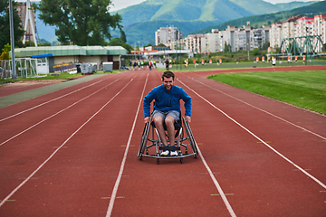 Image showing A person with disability in a wheelchair training tirelessly on the track in preparation for the Paralympic Games