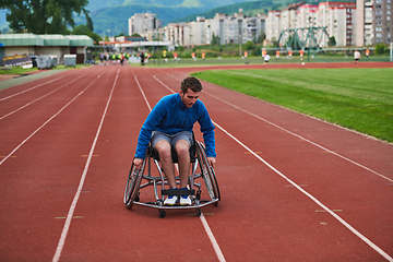 Image showing A person with disability in a wheelchair training tirelessly on the track in preparation for the Paralympic Games