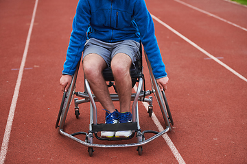 Image showing A person with disability in a wheelchair training tirelessly on the track in preparation for the Paralympic Games