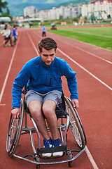 Image showing A person with disability in a wheelchair training tirelessly on the track in preparation for the Paralympic Games