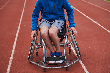 Image showing A person with disability in a wheelchair training tirelessly on the track in preparation for the Paralympic Games