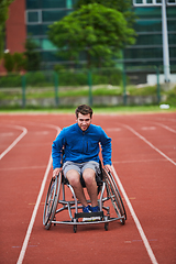 Image showing A person with disability in a wheelchair training tirelessly on the track in preparation for the Paralympic Games