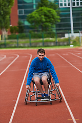 Image showing A person with disability in a wheelchair training tirelessly on the track in preparation for the Paralympic Games