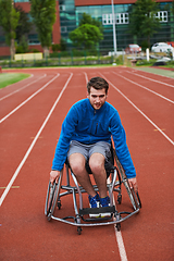 Image showing A person with disability in a wheelchair training tirelessly on the track in preparation for the Paralympic Games