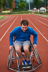Image showing A person with disability in a wheelchair training tirelessly on the track in preparation for the Paralympic Games