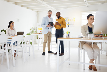 Image showing Business men, tablet and partnership in discussion, planning or schedule with mature CEO for project in startup. Corporate people, group and teamwork with computer, women and ideas in SEO company