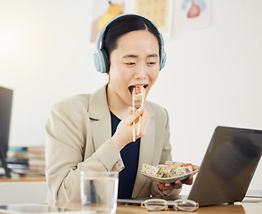 Image showing Fast food, delivery and asian woman with laptop in office for lunch break, eating and meal. Sushi, brunch and Japanese designer online with positive review, survey or feedback for takeout service