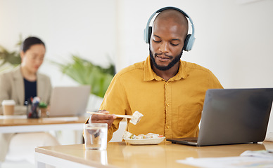 Image showing Delivery, fast food and black man with laptop in office for lunch break, eating and meal. Sushi, brunch and African manager online with positive review, survey or feedback for takeout order service