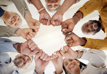 Image showing Team building, fist bump and business people portrait in office for teamwork, support or faith from below. Diversity, hands and team face together sign for union, trust and partnership or motivation