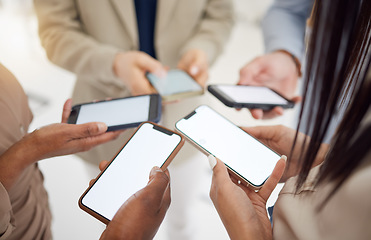 Image showing Business people, group and hands with phone, screen and mockup for advertising, digital marketing or social network. Closeup, team and space on mobile software for multimedia, app or download UX data