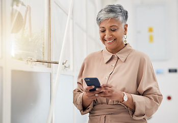 Image showing Senior woman, phone text and networking in a office with a smile and mobile planning for digital work. Person, female professional and happy from contact and social media scroll for business online