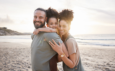 Image showing Portrait, hug and family with sunset, beach and love with vacation, journey and ocean getaway. Happy parents, mother or father with girl, child or embrace with seaside holiday, adventure and travel