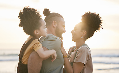 Image showing Love, family and smile at beach at sunset, bonding and having fun together. Happy, mother and father of child at ocean in interracial care on summer holiday, vacation trip and travel outdoor at sea