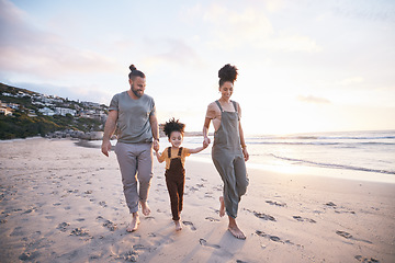 Image showing Family, holding hands and walking on beach at sunset, bonding and mockup space. Father, mother and happy kid at ocean in interracial care, love or smile on vacation, holiday or summer travel together