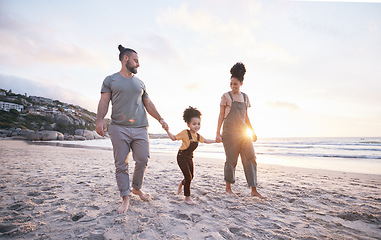 Image showing Holding hands, family and walk on beach at sunset, bonding and mockup space. Father, mother and happy kid at ocean in interracial care, love or smile on vacation, holiday or summer travel together