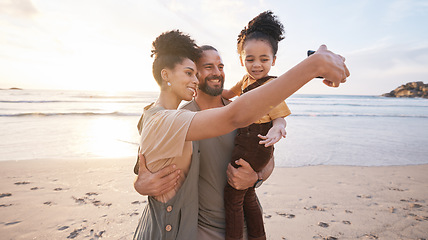 Image showing Happy family, selfie and together on beach, vacation or memory of tropical island, holiday in Bali and bonding in summer. Ocean, sunset and parents with child in hug with love, care and support