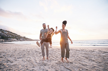 Image showing Travel, swing and holding hands with family at beach for bonding, summer vacation and happy. Smile, sunset and relax with parents and child walking on seaside holiday for love, freedom and support
