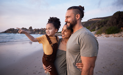 Image showing Child, pointing and happy family on beach at sunset on summer, vacation or bonding together on tropical holiday in Costa Rica. Ocean, view and interracial parents support girl or kid show with hand