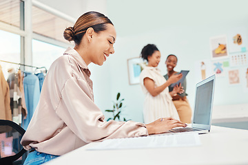 Image showing Laptop typing, woman and at a boutique for fashion, communication and working in retail. Smile, ecommerce and a female stylist or girl with a computer for online website for a clothing store