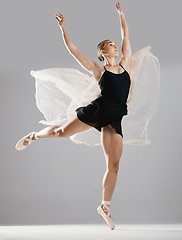 Image showing Ballet, woman or dancer with pose, training or performance on white studio background. Female performer, ballerina or artist with technique, stretch for a show or elegant art with creative or fitness