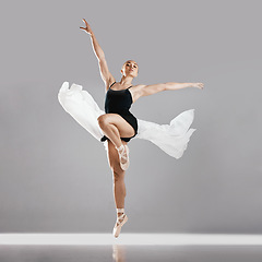 Image showing Ballet, woman or dancer with portrait, performance or exercise on white studio background. Female performer, ballerina or artist with technique, prepare for show or training with pose or elegant art