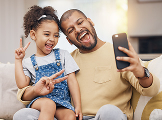 Image showing Father, girl and peace sign selfie in home living room, bonding and funny together. Dad, child and excited in v hand on profile picture, happy memory or social media post of family laughing on sofa