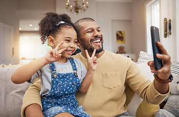 Image showing Selfie, happy and a father and child with a peace sign on the sofa for social media or a video call. Smile, family and a dad taking a photo with a girl kid and a gesture for live streaming in a house