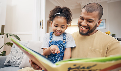 Image showing Dad, daughter and book on sofa together, bonding and love in storytelling in living room with smile. Happiness, father and child reading story on couch for fantasy, learning and education in home fun