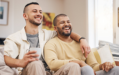 Image showing Happy, laugh and gay couple watching a movie on a sofa while relaxing with a cup of coffee. Love, bonding and young lgbtq men with a latte streaming a film, show or video online in the living room.