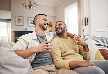 Image showing Happy, home and a gay couple on the sofa with coffee, conversation or love in a house. Smile, together and lgbt men on the living room couch for a funny story, communication or speaking with tea