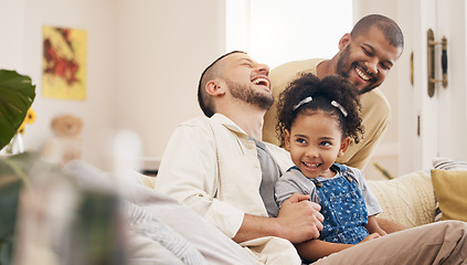 Image showing Gay family, laughing and a child on a home sofa with love, care and funny joke in lounge. Lgbtq men, adoption and parents with foster girl kid together on a couch for happiness, bonding and to relax