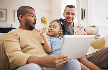 Image showing Tablet, gay family and child on home sofa for e learning, watch video and education on internet. Adoption, lgbt men or parents with a happy kid and technology for streaming movies, games or app