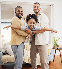 Image showing Gay parents, girl and portrait of playing in home or holding kid as a plane, lifting or flying in living room for fun bonding game. Happy family, father and dad support child in the air or lounge