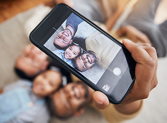 Image showing Selfie, gay dad and blended family with a girl lying together on the floor of the home for a photograph from above. LGBT love, children or kids and a daughter with her happy parents taking a picture