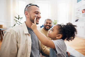 Image showing Blended family, gay parents and makeup with a girl in the living room of her home for princess fantasy. LGBT, love or adoption and a daughter together with her father on the sofa for bonding closeup