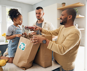 Image showing Happy family, shopping and bags of groceries in home and curious, excited girl with gay parents, dad and father in kitchen. Sustainable, paper bag and kid with eco friendly grocery, product or fruit