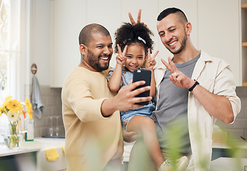 Image showing Selfie, blended family and a happy girl with her gay parents in the kitchen together for a profile picture. Adoption photograph, smile or love and a playful daughter with her lgbt father in the home