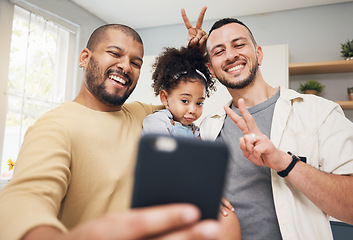 Image showing Selfie, blended family and a happy girl with her lgbt parents in the kitchen together for a profile picture. Adoption photograph, smile or love and a playful daughter with her gay father in the home