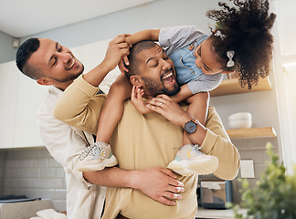 Image showing Gay, happy family and playing with child in home or parents together with love, support and girl on shoulders of dad. LGBT, fathers and men with happiness, smile and fun bonding in kitchen with kid