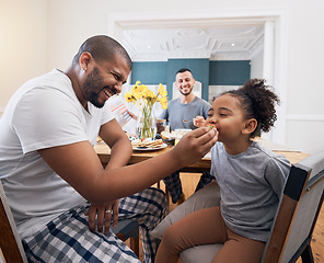 Image showing Gay couple, breakfast and dad feeding kid meal, food or cereal for morning wellness, care and youth development support. Family, adoption and non binary father smile for hungry child eating at home