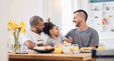 Image showing Happy, gay men and family at breakfast together in the dining room of their modern house. Smile, bonding and girl child eating a healthy meal for lunch or brunch with her lgbtq dads at home.