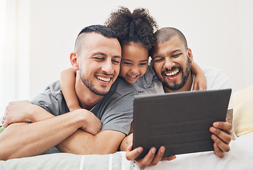 Image showing Tablet, gay family and child on a bed at home for e learning, watch video and education on internet. Adoption, lgbt men or parents with a happy kid and technology for streaming movies, games or app