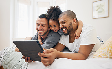 Image showing Child, gay family and tablet on bed at home for e learning, watch video and education on internet. Adoption, lgbt men or parents with happy kid and technology for streaming movies, games or funny app