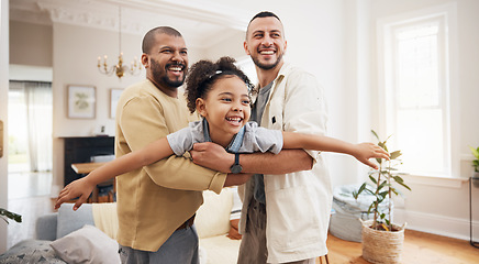 Image showing Gay parents, girl and playing as airplane in home or holding kid as a plane, lifting or flying in living room for fun bonding game. LGBT, father and dad support child together in the air or lounge