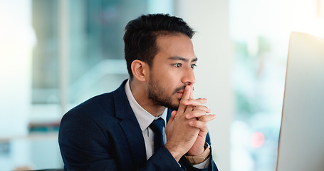 Image showing Stressed web developer suffering with mental block while trying to code on a computer in his office. Frustrated data scientist struggling with fatigue and feeling the pressure to hit his deadline